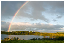 A rainbow over a lake