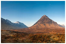 A mountain with clear skies above.